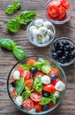 Salad with tomatoes, olives, mozzarella and basil Royalty Free Stock Photo