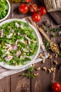 Salad with tomatoes and roasted nuts Royalty Free Stock Photo