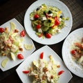 Salad top view. Plates on table. Food photography concept. Healthy diet. Square crop size