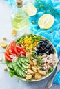 Salad with tuna, fresh tomato, cucumber, onion, pickled olives, corn and salad dressing vinaigrette Royalty Free Stock Photo