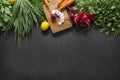 Salad vegetable concept with cutting board on rustic background, organic fresh and raw green vegetables Royalty Free Stock Photo