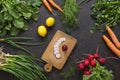 Salad vegetable concept with cutting board on rustic background, organic fresh and raw green vegetables Royalty Free Stock Photo