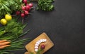 Salad vegetable concept with cutting board on rustic background, organic fresh and raw green vegetables Royalty Free Stock Photo