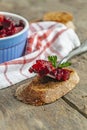 Salad vinaigrette and a portion on a fork on a wooden background Royalty Free Stock Photo