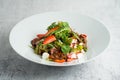 Salad with warm chicken liver, fresh strawberries and vegetables