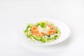 Salad in a white plate of red fish, fresh cucumbers and eggs. Royalty Free Stock Photo