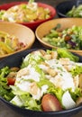 Salads on colorful bowls over stone background Royalty Free Stock Photo