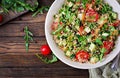 Salads with quinoa, arugula, radish, tomatoes and cucumber Royalty Free Stock Photo