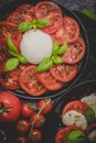 Salads with traditional italian burrata and mozzarella cheese with arugula and tomatoes
