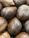 salak, a scaly-skinned fruit with sweet, sour and astringent flesh