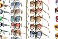 Display rack full of various sunglasses. Royalty Free Stock Photo