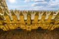 Salamanca cathedral roofs with stone wall in sunny day and blue sky.