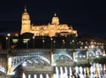 Salamanca skyline at night and Enrique Esteban Bridge over Tormes River Royalty Free Stock Photo