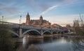 Salamanca Skyline view with Cathedral and Enrique Estevan Bridge from Tormes River at sunset - Salamanca, Castile and Leon, Spain Royalty Free Stock Photo