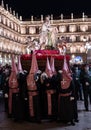 Brotherhood carrying paso of Flagellated Jesus during Holy Week procession in Salamanca