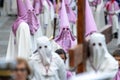 SALAMANCA, SPAIN - APRIL 18, 2019: Typical scene of the Spanish Holy Week, with religious wearing the typical Easter cap, and one Royalty Free Stock Photo