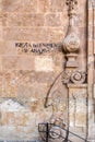 Handwritten sign on the wall in Salamanca in traditional style