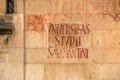 Handwritten sign on the wall in Salamanca in traditional style