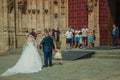 People looking at bride in front the New Cathedral at Salamanca