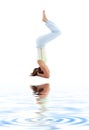 Salamba sirsasana supported headstand on white san Royalty Free Stock Photo