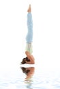 Salamba sirsasana supported headstand on white sand Royalty Free Stock Photo