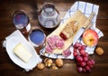 Salami, cheese, grapes, apple, walnuts and red wine. Top view. Royalty Free Stock Photo