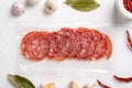 Salami Milano pack Italian sausage, on white stone table background, top view flat lay Royalty Free Stock Photo