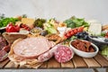 Salami and Parma sausage close-up. Table full of mediterranean appetizers, tapas or antipasto. Assorted Italian food set Royalty Free Stock Photo
