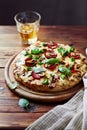 Salami Pizza with Mushrooms and a Glass of Beer Royalty Free Stock Photo