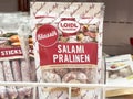 Salami pralinen in grocery store display with classic packaging Royalty Free Stock Photo