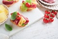 Salami sandwich. Delicious toasted sandwiches with slice salami, cheddar cheese lettuce and tomatoes cherry on white marble Royalty Free Stock Photo