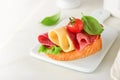 Salami sandwich. Delicious toasted sandwiches with slice salami, cheddar cheese lettuce and tomatoes cherry on white marble Royalty Free Stock Photo