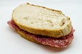 Salami sandwich, panino al salame, isolated on white background Royalty Free Stock Photo