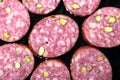 Salami sausage with pistachios slices full frame Royalty Free Stock Photo