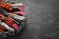 Salami, sausages, spices and meat products in a wooden box. Top view. Royalty Free Stock Photo