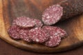 Salami sliced on wooden board Royalty Free Stock Photo