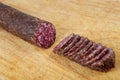 Salami sliced on wooden board Royalty Free Stock Photo