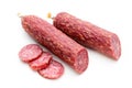 Salami smoked sausage, basil leaves and peppercorns isolated on