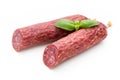 Salami smoked sausage, basil leaves and peppercorns isolated on white background Royalty Free Stock Photo