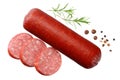 Salami smoked sausage with slices, rosemary and peppercorns isolated on white background. top view Royalty Free Stock Photo