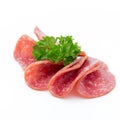 Salami smoked sausages slices isolated on white background. Royalty Free Stock Photo