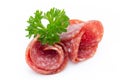 Salami smoked sausages slices isolated on white background.