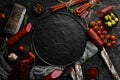 Salami and snacks. Sausage Fouet, sausages, salami, paperoni, on a black stone background. Top view. Royalty Free Stock Photo