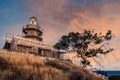 Salamis island, Greece. The stone built lighthouse at cape Koghi on sunse timet