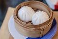 Salapao or pork steamed bun served in the basket. Ready to eat. Traditional Chinese food Royalty Free Stock Photo