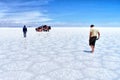 Salar de Uyuni Bolivia salt desert - men and car