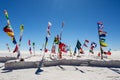 The Salar de Uyuni. Solar pedestal with different flags. Flags of different countries in Bolivia, Uyuni salt marsh