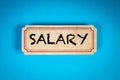 Salary. Cardboard sticker with text on a blue background Royalty Free Stock Photo