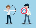 Salary Man stand and holding a shield in the form of a target And colleagues held a bow aim to target