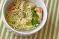 Salad with cabbage leaves and mushrooms in white bowl. close up